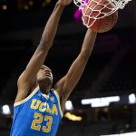 
              UCLA guard Peyton Watson dunks during the first half of the team's NCAA college basketball game against Bellarmine on Monday, Nov. 22, 2021, in Las Vegas. (AP Photo/Ellen Schmidt)
            