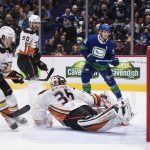 
              Vancouver Canucks' Bo Horvat's shot bounces off the post and stays out of the net behind Anaheim Ducks goalie John Gibson (36) as Cam Fowler (4) and Benoit-Olivier Groulx (50) watch during the second period of an NHL hockey game in Vancouver, British Columbia, on Tuesday, Nov. 9, 2021. (Darryl Dyck/The Canadian Press via AP)
            