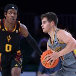 
              In a photo provided by Bahamas Visual Services, Loyola Chicago guard Braden Norris (4) is defended by Arizona State's DJ Horne (0) during an NCAA college basketball game at Paradise Island, Bahamas, Friday, Nov. 26, 2021. (Tim Aylen/Bahamas Visual Services via AP)
            