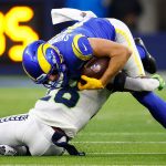 INGLEWOOD, CALIFORNIA - DECEMBER 21: Ben Skowronek #18 of the Los Angeles Rams is tackled by Ugo Amadi #28 of the Seattle Seahawks in the first quarter of the game at SoFi Stadium on December 21, 2021 in Inglewood, California. (Photo by Ronald Martinez/Getty Images)