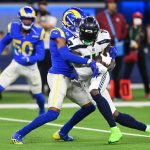 INGLEWOOD, CALIFORNIA - DECEMBER 21: DK Metcalf #14 of the Seattle Seahawks is stopped by Jalen Ramsey #5 of the Los Angeles Rams in the third quarter of the game at SoFi Stadium on December 21, 2021 in Inglewood, California. (Photo by Jayne Kamin-Oncea/Getty Images)