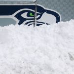 SEATTLE, WASHINGTON - DECEMBER 26: The Seattle Seahawks logo with snow piled up in front of it before the game against the Chicago Bears at Lumen Field on December 26, 2021 in Seattle, Washington. (Photo by Abbie Parr/Getty Images)
