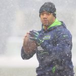SEATTLE, WASHINGTON - DECEMBER 26: Russell Wilson #3 of the Seattle Seahawks throws the ball during warm-ups before the game against the Chicago Bears at Lumen Field on December 26, 2021 in Seattle, Washington. (Photo by Abbie Parr/Getty Images)