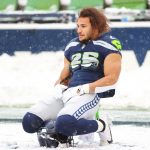 SEATTLE, WASHINGTON - DECEMBER 26: Travis Homer #25 of the Seattle Seahawks on the field during warm-ups before the game against the Chicago Bears at Lumen Field on December 26, 2021 in Seattle, Washington. (Photo by Abbie Parr/Getty Images)