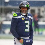 SEATTLE, WASHINGTON - DECEMBER 26: Russell Wilson #3 of the Seattle Seahawks looks on during warm-ups before the game against the Chicago Bears at Lumen Field on December 26, 2021 in Seattle, Washington. (Photo by Abbie Parr/Getty Images)