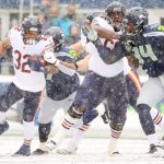 SEATTLE, WASHINGTON - DECEMBER 26: David Montgomery #32 of the Chicago Bears runs the ball during the first quarter against the Seattle Seahawks at Lumen Field on December 26, 2021 in Seattle, Washington. (Photo by Abbie Parr/Getty Images)