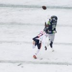SEATTLE, WASHINGTON - DECEMBER 26: DK Metcalf #14 of the Seattle Seahawks catches the ball over Thomas Graham Jr. #27 of the Chicago Bears for a touchdown during the first quarter at Lumen Field on December 26, 2021 in Seattle, Washington. (Photo by Steph Chambers/Getty Images)