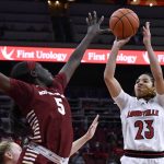 
              Louisville guard Chelsie Hall (23) shoots over Boston College forward Maria Gakdeng (5) during the second half of an NCAA college basketball game in Louisville, Ky., Thursday, Dec. 30, 2021. Louisville won 79-49. (AP Photo/Timothy D. Easley)
            