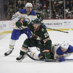 
              Minnesota Wild defenseman Jonas Brodin (25) and Buffalo Sabres center Dylan Cozens (24) get tangled up trying to gain control of the puck during the second period of an NHL hockey game Thursday, Dec. 16, 2021, in St. Paul, Minn. (AP Photo/Stacy Bengs)
            