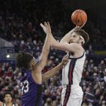 
              Gonzaga forward Drew Timme, right, shoots over North Alabama forward Damian Forrest during the first half of an NCAA college basketball game, Tuesday, Dec. 28, 2021, in Spokane, Wash. (AP Photo/Young Kwak)
            
