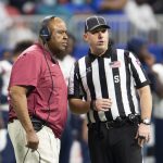 
              South Carolina State head coach Oliver Pough speaks with a referee during the first half of the Cricket Celebration Bowl NCAA college football game against Jackson State, Saturday, Dec. 18, 2021, in Atlanta. (AP Photo/Hakim Wright Sr.)
            