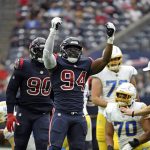 
              Houston Texans defensive end Charles Omenihu (94) celebrates after sacking Los Angeles Chargers quarterback Justin Herbert during the first half of an NFL football game Sunday, Dec. 26, 2021, in Houston. (AP Photo/Justin Rex)
            