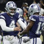 
              Dallas Cowboys quarterback Dak Prescott (4) celebrates the touchdown by Dallas Cowboys wide receiver Michael Gallup (13) during the first half of an NFL football game against the New Orleans Saints, Thursday, Dec. 2, 2021, in New Orleans. (AP Photo/Derick Hingle)
            