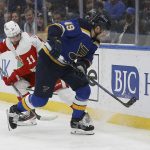
              St. Louis Blues' Ivan Barbashev (49) controls the puck while under pressure from Detroit Red Wings' Filip Zadina (11) during the second period of an NHL hockey game Thursday, Dec. 9, 2021, in St. Louis. (AP Photo/Scott Kane)
            