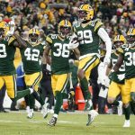 
              Green Bay Packers' Rasul Douglas celebrates his interception with teammates during the second half of an NFL football game against the Cleveland Browns Saturday, Dec. 25, 2021, in Green Bay, Wis. The Packers won 24-22. (AP Photo/Morry Gash)
            
