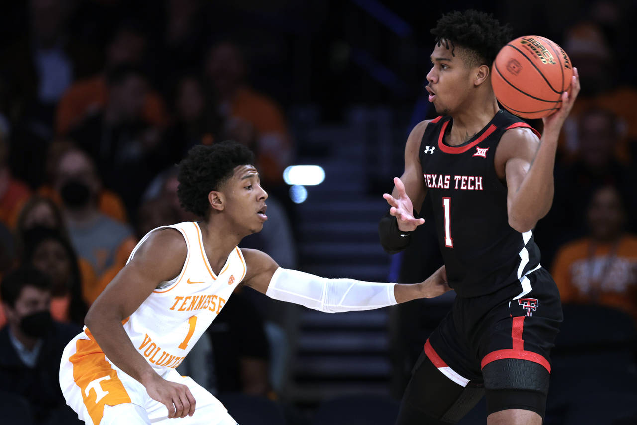 Texas Tech guard Terrence Shannon Jr. looks to pass around Tennessee guard Kennedy Chandler during ...