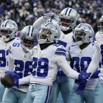 
              Dallas Cowboys safety Malik Hooker (28) celebrates with teammates after intercepting a pass against the New York Giants during the fourth quarter of an NFL football game, Sunday, Dec. 19, 2021, in East Rutherford, N.J. (AP Photo/Seth Wenig)
            