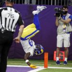 
              Los Angeles Rams' Brandon Powell flips into the end zone during a 61-yard punt return for a touchdown in the second half of an NFL football game against the Minnesota Vikings, Sunday, Dec. 26, 2021, in Minneapolis. (AP Photo/Bruce Kluckhohn)
            