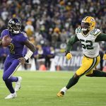
              Baltimore Ravens quarterback Tyler Huntley (2) looks for a receiver as he is chased by Green Bay Packers outside linebacker Rashan Gary in the first half of an NFL football game, Sunday, Dec. 19, 2021, in Baltimore. (AP Photo/Nick Wass)
            