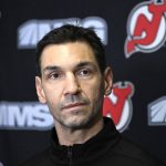 
              New Jersey Devils assistant coach Alain Nasreddine talks with the media before an NHL hockey game between the Devils and the Edmonton Oilers Friday, Dec. 31, 2021, in Newark, N.J. Nasreddine will be coaching the Devils today as head coach Lindy Ruff in in covid protocol. (AP Photo/Bill Kostroun)
            
