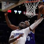 
              Los Angeles Clippers guard Reggie Jackson (1) shoots against Los Angeles Lakers center Dwight Howard (39) during the first half of an NBA basketball game in Los Angeles, Friday, Dec. 3, 2021. (AP Photo/Ashley Landis)
            
