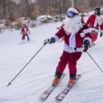 
              Skiers and snowboarders hit the slopes Sunday, Dec. 5, 2021 at Sunday River Ski Resort in Newry, Maine. The Santas gathered for the 21st annual Santa Sunday which raised over $4600 for the River Fund. (Andree Kehn/Sun Journal via AP)
            
