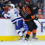 
              Tampa Bay Lightning's Ross Colton, left, and Philadelphia Flyers' Zack MacEwen collide during the second period of an NHL hockey game, Sunday, Dec. 5, 2021, in Philadelphia. (AP Photo/Matt Slocum)
            