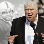 
              FILE - Former Oakland Raiders head coach John Madden speaks about former quarterback Ken Stabler, pictured at rear, at a ceremony honoring Stabler during halftime of an NFL football game between the Raiders and the Cincinnati Bengals in Oakland, Calif., Sept. 13, 2015. John Madden, the Hall of Fame coach turned broadcaster whose exuberant calls combined with simple explanations provided a weekly soundtrack to NFL games for three decades, died Tuesday, Dec. 28, 2021, the NFL said. He was 85. (AP Photo/Ben Margot, File)
            