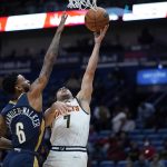 
              Denver Nuggets guard Facundo Campazzo (7) goes to the basket against New Orleans Pelicans guard Nickeil Alexander-Walker (6) in the first half of an NBA basketball game in New Orleans, Wednesday, Dec. 8, 2021. (AP Photo/Gerald Herbert)
            