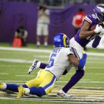 
              Minnesota Vikings wide receiver Justin Jefferson (18) catches a pass ahead of Los Angeles Rams cornerback Jalen Ramsey (5) during the second half of an NFL football game, Sunday, Dec. 26, 2021, in Minneapolis. (AP Photo/Bruce Kluckhohn)
            
