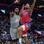 
              Detroit Pistons guard Rodney McGruder (17) attempts a layup as Brooklyn Nets center LaMarcus Aldridge (21) defends during the first half of an NBA basketball game, Sunday, Dec. 12, 2021, in Detroit. (AP Photo/Carlos Osorio)
            