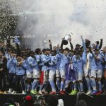 
              New York City FC players celebrate their penalty kick shootout win over the Portland Timbers in the MLS Cup soccer game, Saturday, Dec. 11, 2021, in Portland, Ore. (AP Photo/Amanda Loman)
            