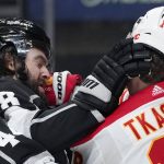 
              Los Angeles Kings defenseman Drew Doughty, left, and Calgary Flames left wing Matthew Tkachuk scuffle during the first period of an NHL hockey game Thursday, Dec. 2, 2021, in Los Angeles. (AP Photo/Mark J. Terrill)
            