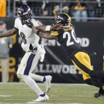 
              Pittsburgh Steelers cornerback Cameron Sutton (20) chases after Baltimore Ravens quarterback Lamar Jackson (8) during the second half of an NFL football game, Sunday, Dec. 5, 2021, in Pittsburgh. (AP Photo/Gene J. Puskar)
            