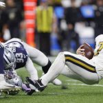 
              Dallas Cowboys middle linebacker Keanu Neal (42) and Dallas Cowboys defensive end Tarell Basham (93) tackle New Orleans Saints quarterback Taysom Hill (7) during the second half of an NFL football game, Thursday, Dec. 2, 2021, in New Orleans. (AP Photo/Brett Duke)
            