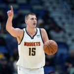 
              Denver Nuggets center Nikola Jokic (15) moves the ball down court in the first half of an NBA basketball game against the New Orleans Pelicans in New Orleans, Wednesday, Dec. 8, 2021. (AP Photo/Gerald Herbert)
            