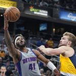 
              Detroit Pistons' Saddiq Bey (41) puts up a shot against Indiana Pacers' Domantas Sabonis (11) during the first half of an NBA basketball game, Thursday, Dec. 16, 2021, in Indianapolis. (AP Photo/Darron Cummings)
            