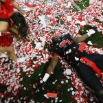 
              Utah offensive lineman Bamidele Olaseni lies in confetti on the field after Utah defeated Oregon 38-10 to win the Pac-12 Conference championship NCAA college football game Friday, Dec. 3, 2021, in Las Vegas. (AP Photo/Chase Stevens)
            