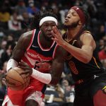 
              Washington Wizards' Montrezl Harrell, left, is fouled by Cleveland Cavaliers' Lamar Stevens (8) during the first half of an NBA basketball game, Friday, Dec. 3, 2021, in Washington. (AP Photo/Luis M. Alvarez)
            