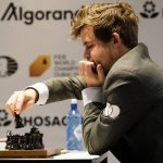 
              Magnus Carlsen of Norway competes during the FIDE World Championship at Dubai Expo 2020 in Dubai, United Arab Emirates, Friday, Dec. 10, 2021. (AP Photo/Jon Gambrell)
            