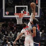 
              Minnesota Timberwolves' Karl-Anthony Towns, right, is fouled by Washington Wizards' Daniel Gafford during the first half of an NBA basketball game Wednesday, Dec. 1, 2021, in Washington. (AP Photo/Luis M. Alvarez)
            