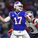 
              Buffalo Bills quarterback Josh Allen (17) passes under pressure by New England Patriots outside linebacker Matt Judon (9) during the first half of an NFL football game in Orchard Park, N.Y., Monday, Dec. 6, 2021. (AP Photo/Adrian Kraus)
            