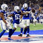 
              Indianapolis Colts outside linebacker Darius Leonard (53) celebrates along with teammates Kenny Moore II (23) and Khari Willis after intercepting a pass during the first half of an NFL football game against the New England Patriots Saturday, Dec. 18, 2021, in Indianapolis. (AP Photo/Aaron Doster)
            
