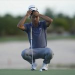 
              Collin Morikawa of the United States, adjusts his cap as he prepares a putter shot on the 17th green on day three of the Hero World Challenge PGA Tour at the Albany Golf Club, in New Providence, Bahamas, Saturday, Dec. 4, 2021.(AP Photo/Fernando Llano)
            