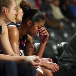 
              Connecticut guard Evina Westbrook (22) sits on the bench in the final moments of the team's loss to Georgia Tech in an NCAA college basketball game Thursday, Dec. 9, 2021, in Atlanta. (AP Photo/John Bazemore)
            