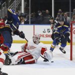 
              St. Louis Blues' Colton Parayko (55) scores a goal past Detroit Red Wings goaltender Alex Nedeljkovic (39) during the second period of an NHL hockey game Thursday, Dec. 9, 2021, in St. Louis. (AP Photo/Scott Kane)
            