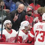 
              Detroit Red Wings head coach Jeff Blashill, top center, gestures as he talks to his players during a timeout in the second period of an NHL hockey game against the Colorado Avalanche, Friday, Dec. 10, 2021, in Denver. (AP Photo/David Zalubowski)
            