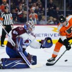 
              Colorado Avalanche's Justus Annunen, left, and Philadelphia Flyers' Patrick Brown watch a shot during the second period of an NHL hockey game, Monday, Dec. 6, 2021, in Philadelphia. (AP Photo/Matt Slocum)
            