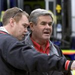 
              FILE - Al Unser Jr., left, talks to his father, Al Unser, before practice at the Miami-Dade Homestead Motorsports Complex in Homestead, Fla., Thursday, Feb. 28, 2002. Unser, one of only four drivers to win the Indianapolis 500 a record four times, died Thursday, Dec. 9, 2021, following years of health issues. He was 82. (AP Photo/Luis M. Alvarez, File)
            