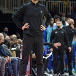 
              Charlotte Hornets coach James Borrego watches from the sideline during the first half of an NBA basketball game Sunday, Dec. 5, 2021, in Atlanta. (AP Photo/Edward M. Pio Roda)
            